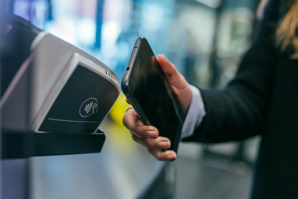 Person using smartphone for contactless payment