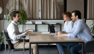 Job interview with three people discussing.