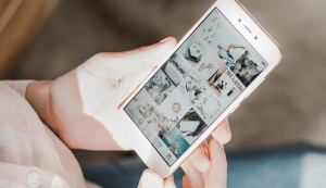 Person browsing Instagram on smartphone