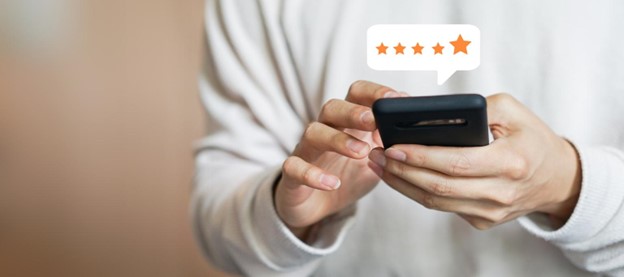close up photo of a man giving 5 as s customer review