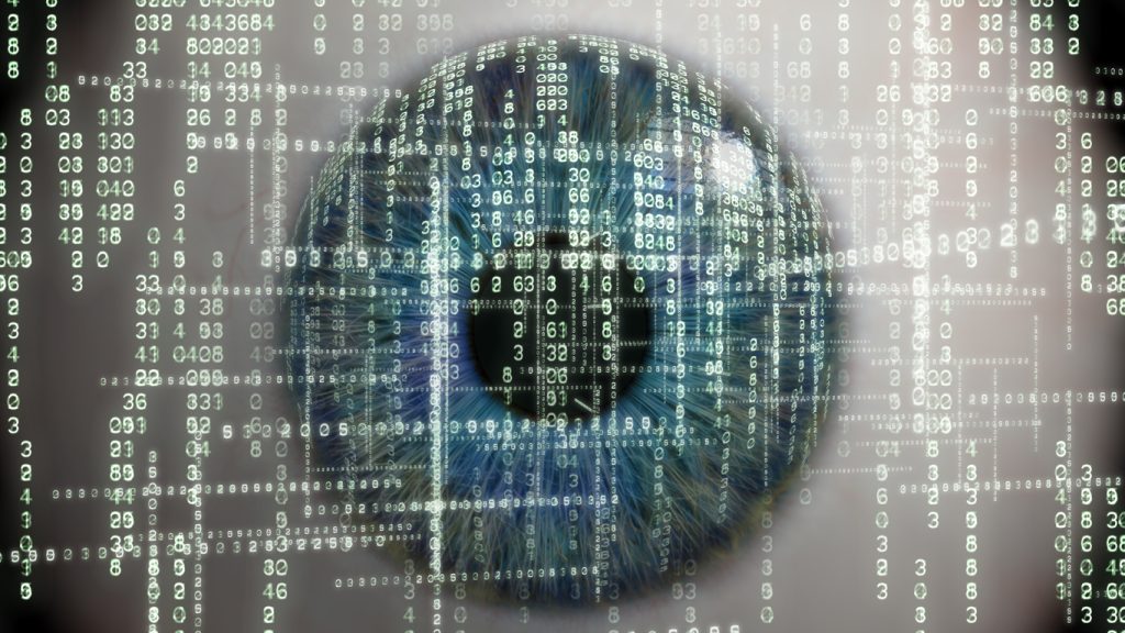 Data discovery concept; close up of a human eye with numbers and data in background