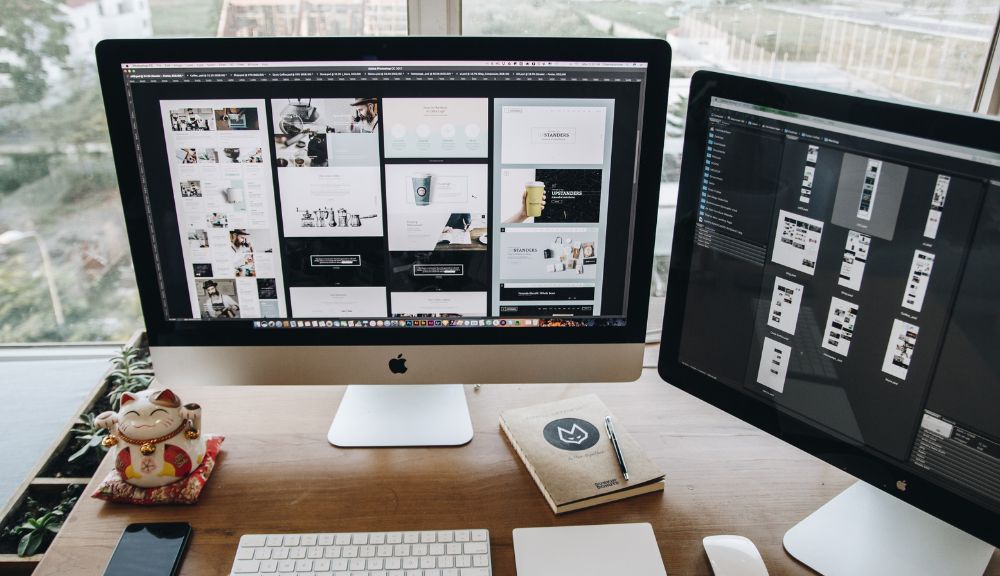 Dual monitors on a designer's workspace