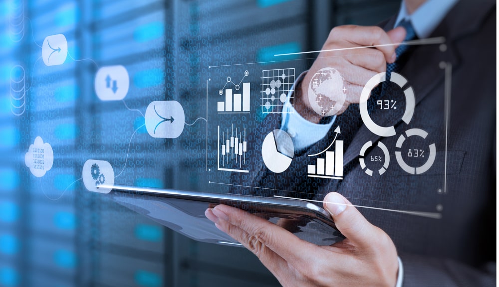 Businessman analyzing digital data graphs on tablet.