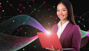 Woman using laptop with digital network background