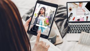 Woman using tablet for online shopping