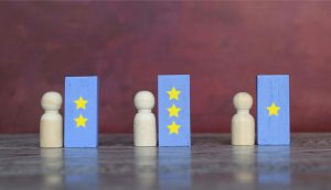 Wood figures with star-marked blocks on table.