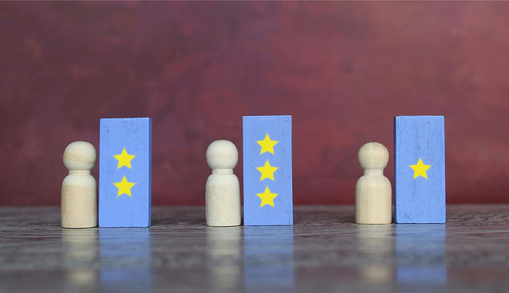 Wood figures with star-marked blocks on table.