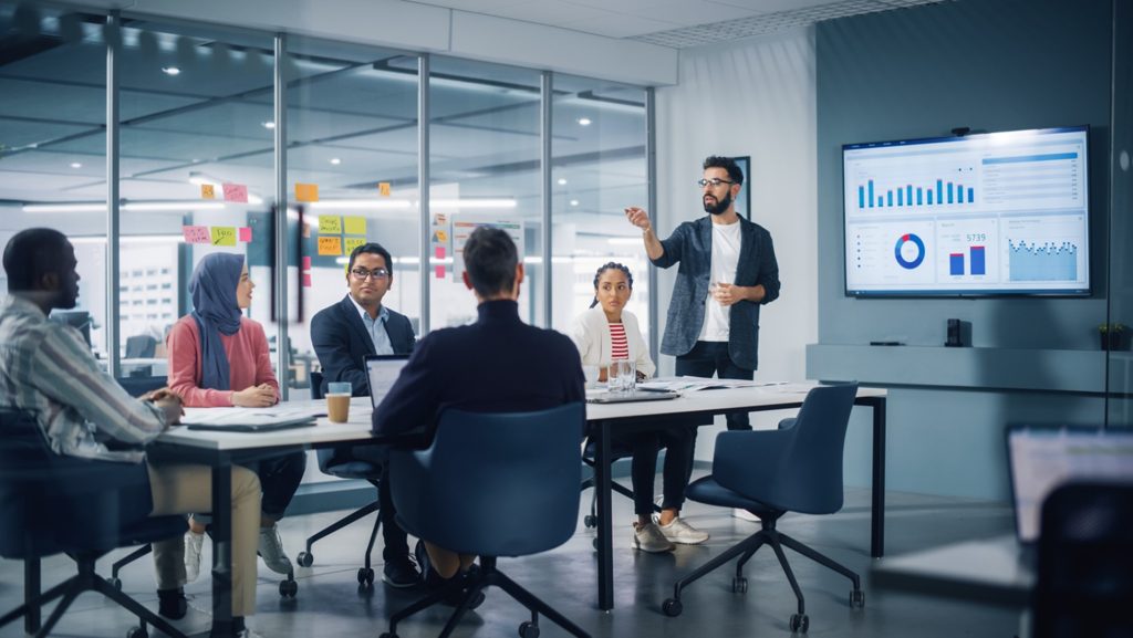 data driven organization: businessman presenting business data driven information