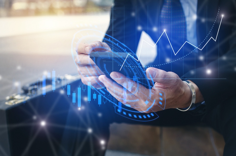 Young Investor Or Business Man Using Mobile Phone With Graphic Global Network Connection And Graph C