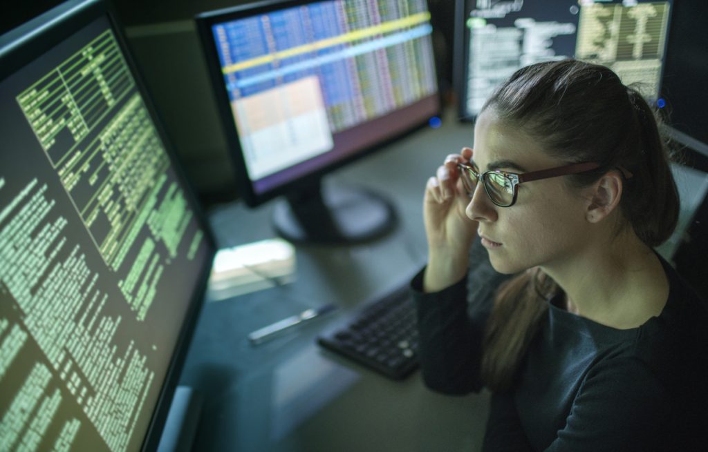 woman data manager tracking data and traffic in her computer
